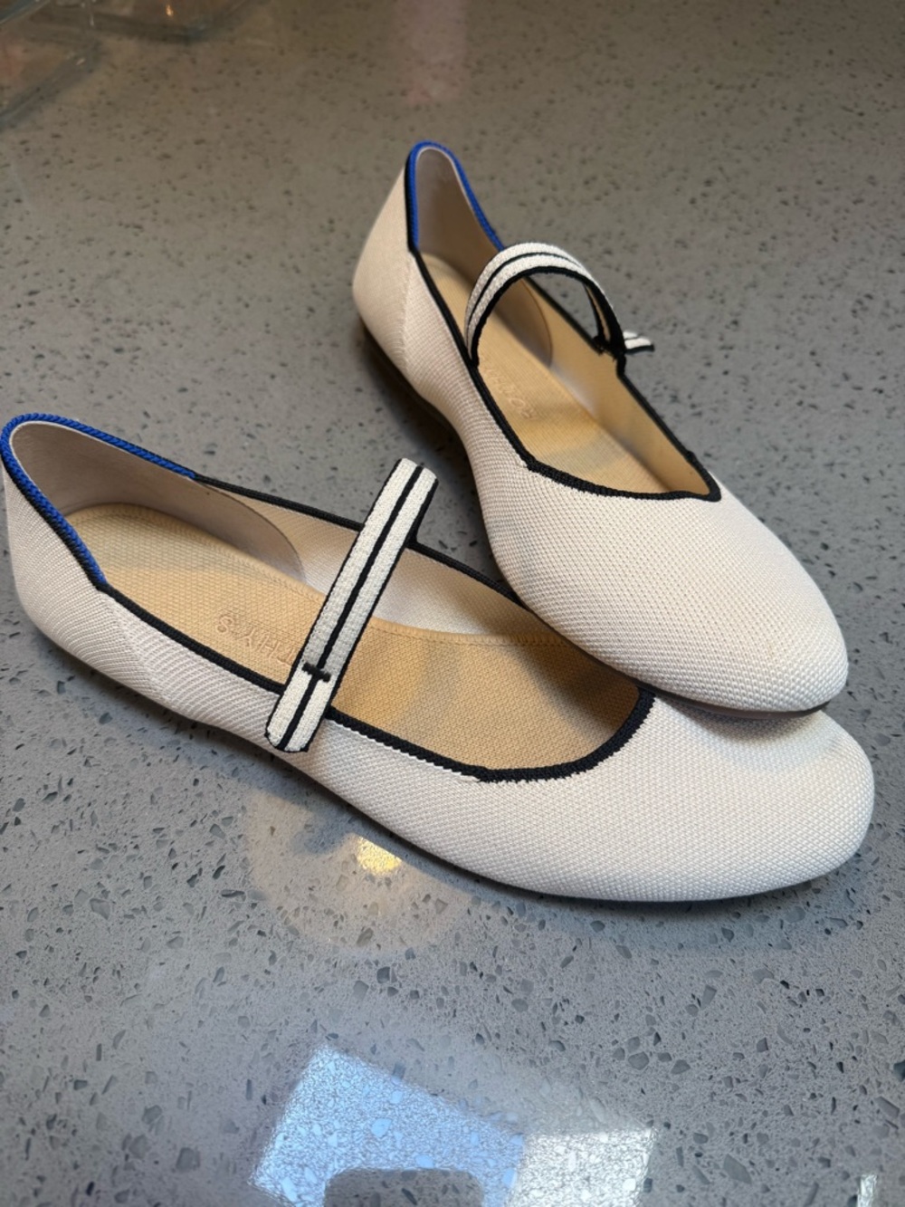 Rothy's Cream Mary Jane Flats with Black Trim and Blue Piping